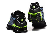 Rear views of Nike Shox TL sneakers showing the heel panels and columned soles.