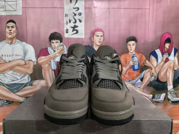 Front view of brown Nike-style sneakers with black mesh panels and dark laces on a shoebox.