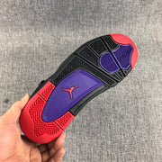Close-up of the outsole with black traction sections, purple center panels, and red forefoot and heel areas.