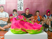 Side view of pink Under Armour sneakers with neon green accents.