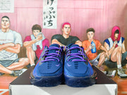 Front view of blue and purple Nike GT basketball shoes with purple laces and mesh-look panels.