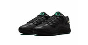 Black Nike sneaker pair with green tongue details shown against a white background; no size range or style code is visible.