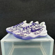 Three-quarter view of the white and purple sneaker pair showing the graphic upper and purple outsole.
