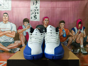 Front view showing white laces, Jumpman tongue logos, and blue textured toe overlays.