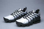 Pair of Nike TN-12 sneakers shown from a three-quarter angle.
