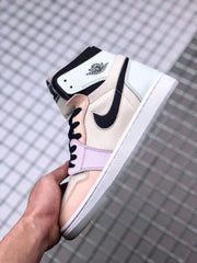 Side profile of the high-top sneaker showing the Jordan winged emblem, black Swoosh, pastel panels, and white midsole.