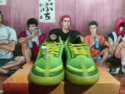 Front view of green Converse Concepts basketball shoes with lime-green laces.