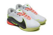 Three-quarter view of the Nike 908-2 pair highlighting the perforated upper and coral laces.