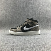 Side profile of the leopard-print mid-top sneaker with black panels and a white rubber outsole.