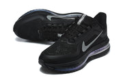 Angled view of black Nike running shoes showing the mesh-like upper, laces and sole.