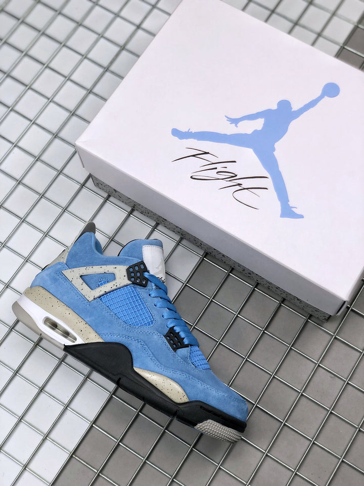 Blue Air Jordan 4 sneaker beside a Jordan shoebox, showing the upper, speckled panels, and white midsole.