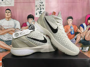 Angled view of the pair showing the patterned uppers, black Swoosh details, and sculpted heels.