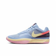 Light blue basketball sneaker with a gold Swoosh, coral heel accent, and pink outsole details.