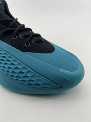 Angled close-up of the shoe’s blue toe and black lace area