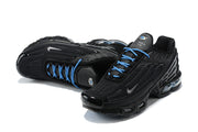 Top and side views of black Nike Air Max Plus sneakers with blue laces.