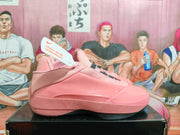 Side view showing the pink upper and layered panels