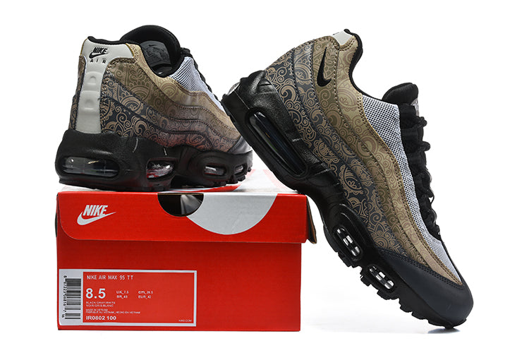 Nike Air Max 95 TT sneakers beside a red box, showing patterned tan and brown panels, white mesh and black sole; box label shows sample size 8.5.