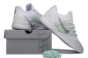 White and silver Nike Sabrina 3 shoes arranged with a matching shoe box