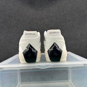 Rear view showing Air Jordan heel branding and glossy black heel details.