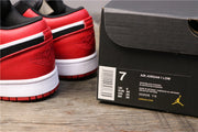 Red heel panels of the Air Jordan 1 Low beside a shoebox label showing EU 40 and style code 553558-116.