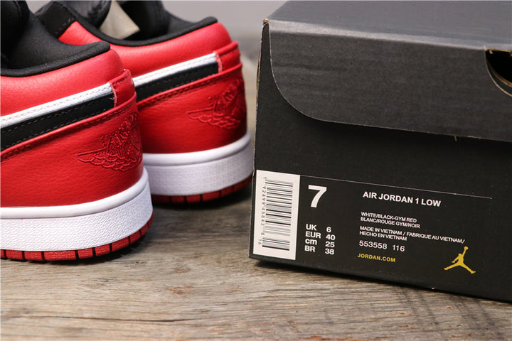 Red heel panels of the Air Jordan 1 Low beside a shoebox label showing EU 40 and style code 553558-116.