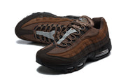 Pair of brown Nike Air Max 95 TT sneakers showing the mesh upper, laces and layered side panels.
