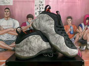Pair of high-top sneakers showing the white and gray cracked-pattern upper, black overlays, and translucent outsole.