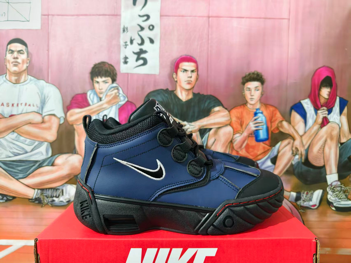 Side view of black and blue Nike Air Destrukt high-top sneakers with white Swoosh and sculpted black soles.