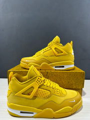 Close angled view of the yellow Jordan Air Jordan 4 pair highlighting the side mesh and layered upper.