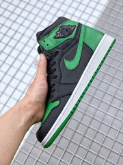 Side profile showing the green collar and heel, black upper panels, and white midsole.