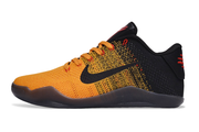 Side profile of a black and yellow-orange lace-up basketball shoe