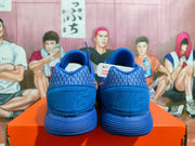 Rear view of blue Nike sneakers showing patterned collars and ribbed soles.