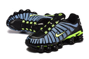 Pair of black, blue, and volt Nike Shox TL sneakers in angled views.