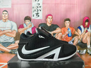 Side profile of a black basketball shoe with white graphics
