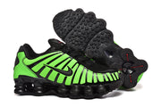 Green-and-black Nike Shox TL sneakers showing the outsole tread.