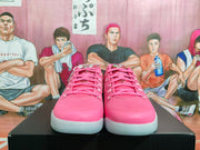 Front view of pink lace-up Nike Kobe basketball shoes