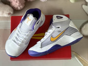 Top-down detail view showing the lace-up fronts, textured tongues, gold tongue logos, and side Swooshes.