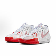 Pair of white Nike basketball sneakers with red outsole accents and red detailing.