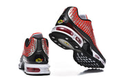 Rear and outsole views of the red, black, and white Nike Air Max Plus sneakers