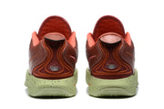 Rear view showing the padded heel construction, layered orange-red detailing, and green speckled soles.