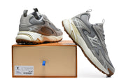 Grey Louis Vuitton sneakers displayed with a shoebox