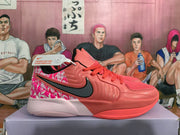 Side view of a coral pink Nike basketball sneaker with black Swoosh branding, patterned heel panel and sculpted sole.