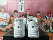 Rear view of white basketball shoes with contrasting heel numbers and Kobe-themed details