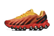 Side profile of an orange and yellow Nike Air Max DN8 sneaker.