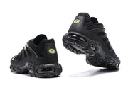 Heel and outsole views of black Nike Air Max Plus sneakers