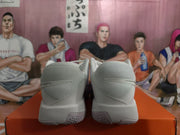 Rear view showing the padded heel sections and textured outsole pattern of the Nike sneakers.