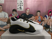Side profile showing the low-top silhouette, contrasting black and white panels, gold-colored trim, and outsole.