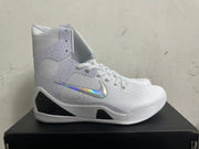 Side view of a white high-top basketball shoe with patterned ankle panels, reflective Swoosh, and dark midsole accents.
