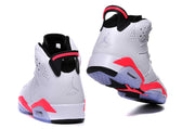 Rear view of the sneakers showing black heel tabs, red trim, embossed Jordan Air branding, and translucent outsole sections.