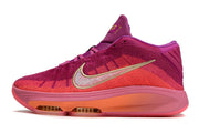 Side profile of pink and purple Nike GT Hustle 3 basketball shoe.